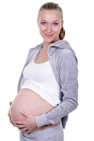 Kleedde zwangere vrouw houdt van haar borsten — Stockfoto
