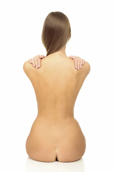 Mujer joven con la espalda desnuda y el pelo largo —  Fotos de Stock