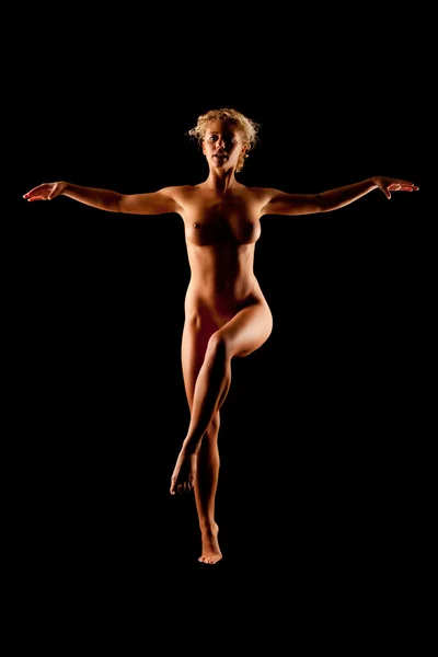 stock image Young naked women on black background